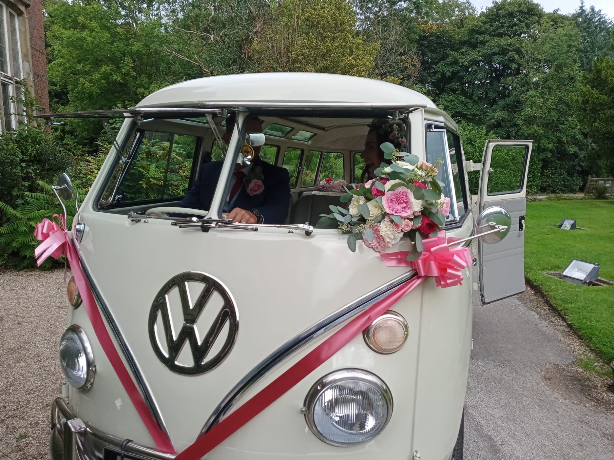 vw campervan with pink ribbon
